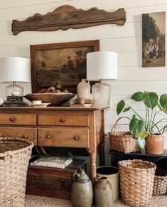 a living room filled with lots of furniture and baskets on top of a rug covered floor