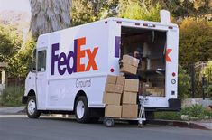 a fedex truck is loaded with boxes