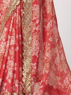 Get everyone's eyes on you by wearing this enticing red color saree made of organza material embellished with sequins, zari embroidery work, and floral with digital print all over. This stunning red floral print organza saree comes with a matching color blouse in organza material with floral print, sequin, and zari embroidery work. This classic red floral printed organza saree is 5.75 meters long and comes with fully unstitched 0.80-meter blouse material. A gorgeous red wedding wear saree that s Red Semi-stitched Pre-draped Saree With Resham Embroidery, Red Chanderi Pre-draped Saree With Dupatta, Red Pre-draped Saree With Sheer Dupatta For Puja, Red Sharara With Sheer Dupatta In Chanderi, Red Georgette Sharara With Cutdana, Celebration Red Sharara With Cutdana, Red Pre-draped Saree With Cutdana For Celebrations, Red Pre-draped Saree With Pallu For Eid, Fitted Red Pre-draped Saree For Eid