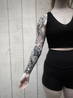 a woman with a tattoo on her arm