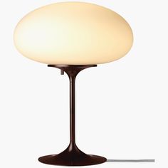 a table lamp with a white light on it's base and a cord attached to the end