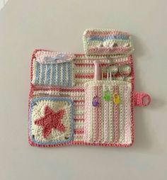 two crocheted purses sitting next to each other