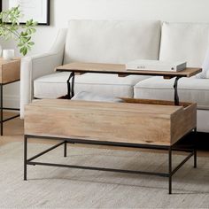 a coffee table with two trays on it in front of a couch and side tables