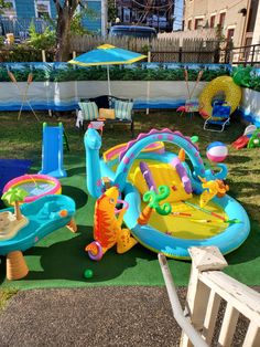 an inflatable pool with toys and umbrellas