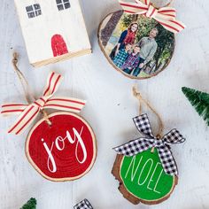 christmas ornaments are displayed on a white table