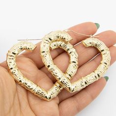 "2\" Heart Bamboo Hoop Earrings Real 10K Yellow Gold *Metal : Real 10K Gold (Properly Stamped, 10K) *Condition : Brand New *Finish : Polished *Weight : 10.09 grams *Length : 2\" = 54mm *Width : 3/16\" = 5mm *Clasp/Bail : Snap Bar All of our items are brand new and are shipped with a gift box." Heart-shaped Pierced Hoop Earrings For Anniversary, Gold Hoop Earrings With Heart Charm, Anniversary Heart Charm Hoop Earrings, Anniversary Hoop Earrings With Heart Charm, Yellow Gold Hoop Earrings For Valentine's Day, Gold Hoop Earrings For Valentine's Day Anniversary, Pierced Hoop Heart Earrings For Anniversary, Gold Metal Hoop Earrings For Valentine's Day, Valentine's Day Anniversary Metal Hoop Earrings