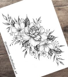 a black and white drawing of flowers on a piece of paper