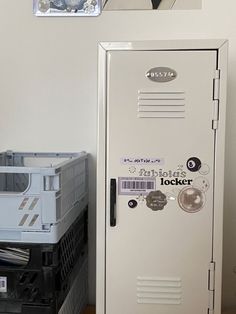 a white locker sitting next to a stack of boxes