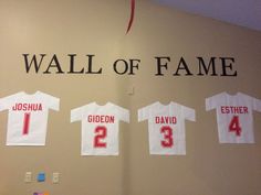 the wall of fame is decorated with t - shirts for each team's favorite player