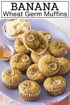 banana wheat germ muffins on a blue plate with bananas and peanut butter