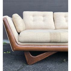 a couch sitting on top of a wooden frame