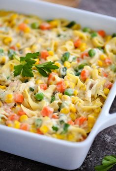 a casserole dish filled with pasta and vegetables