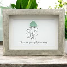 a white frame with a green jellyfish on it and the words i'd pee on your jellyfish string