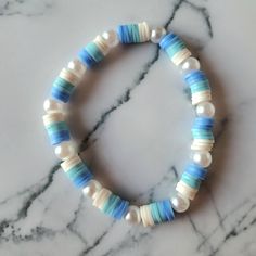 Beautiful beaded bracelet handmade by me. Durable, strong, flexible and stretchy. Fits all. Bracelet Ideas Clay Beads, Pearl Bracelet Ideas, Clay Beads Ideas, Light Blue Bracelet, Clay Beaded Bracelet, Make Clay Beads, Beautiful Beaded Bracelet, Beads Ideas, Bracelets Design