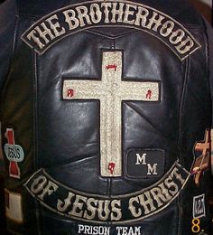 the back of a black leather jacket with a cross and words on it that read, the brotherhood of jesus christ