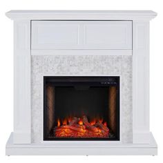 a white fireplace with an electric fire in the center and rocks on the sides, against a white background