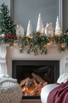 15 Chic Christmas Mantle Decor Ideas for Cozy Fireplaces 37 Christmas Village Console Table, Fireplace Christmas Mantel, January Mantel Decorating Ideas, White Christmas Mantle, Christmas House Decorations Indoor, Christmas Mantle Decor Ideas, Christmas Mantle Ideas, Newport Vineyards