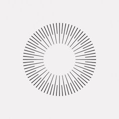 a black and white image of a circle with lines in the shape of a sunburst