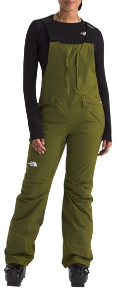 Fit and Design: Standard fit bibs Inner-thigh vents to enhance breathability Adjustable suspenders to customize your fit Belt loops Articulated knees Reinforced kickpatches and hem Cargo pocket with hook-and-loop closure Secure-zip hand pockets Side-entry zip Technology: Heatseeker™ Eco insulation provides warmth even in wet weather Waterproof and breathable seam-sealed DryVent™ 2L fabric helps keep you dry Chimney Venting™ system allows warm air to rise through the stretch mesh gaiter and escape through the inner thigh vents to facilitate continuous airflow StretchVent™ gaiters with gripper elastic amplify airflow while simultaneously keeping snow out of your boots Additional Details: Inseam: S 30”, R 32”, L 34” Fitted Green Bottoms For Outdoor Activities, Ski Overalls Women, Ski Overalls, Bib Snow Pants, Ski Clothes, Womens Athletic Outfits, Hunting Gear, Inner Thigh, Cargo Pocket