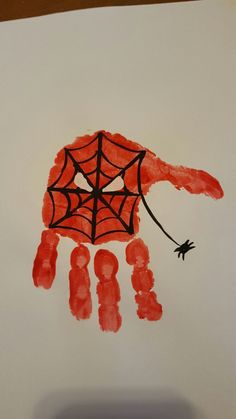 a drawing of a hand holding a spider - man's web hanging from it