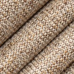 close up view of fabric textured with brown and white colors