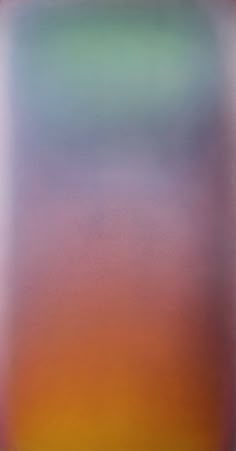 a blurry image of an orange and green square