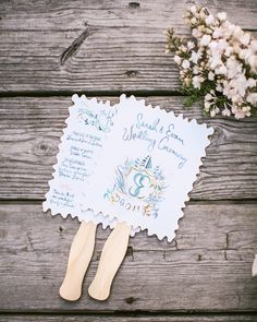 a wedding fan sitting on top of a wooden table