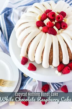 a white chocolate raspberry cake on a plate