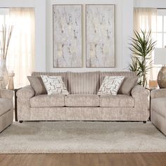 a living room scene with focus on the couch and chairs