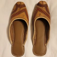 Brand New (Unworn, No Tags) Leather Slippers (Flats) From India -Decorated With Embroidery, And Cut Out Designs -Designs Include Gold Stitching, And Orange/Terra Cotta Colored Designs -Red Bottoms -Handmade Shoes, With Slight Cushion In Sole -Slip-On Style -Due To Handmade Nature -- Sizing Is Approximate. Approximate Size In Us Women's Is Size 8 -Due To Nature Of Pure Leather Material, Leather Will Adapt To You After Wearing Them In Grey Adidas Shoes, Irving Shoes, Kyrie Irving Shoes, Peach Shoes, Curry Shoes, Nike Training Shoes, Blue Slippers, Red Slippers, Fringe Booties