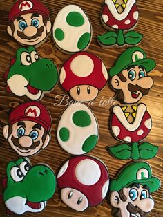 some cookies that are shaped like mario and luigi's mushroom friends on a table