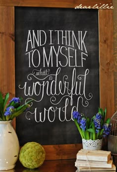 a chalkboard with the words and i think to myself what wonderful world is in it