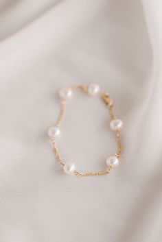 If you're looking for a statement earring for your big day, The Paige set is everything and more. This set is handmade with 6 baroque pearls attached to our 14k gold-filled fiagro chain. It features a 3" front drop connected to a 4" back drop stud. The Paige also comes with the 3" front drop ONLY, if you want to keep it simple but still make a statement. ADD the matching bracelet (7" + 1" extender) to complete the set. Gold Clip-on Earrings With Pearl Drop For Wedding, Chic Gold Clip-on Earrings With Pearl Drop, 14k Gold-filled Pearl Drop Bridal Earrings, Formal 14k Gold-filled Pearl Chain Earrings, Adjustable 14k Gold-filled Pearl Bracelet For Wedding, Jewelry Pearls, Letter Example, Back Drop, Statement Earring