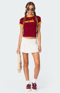 This ringer T-shirt features sporty stripes going down the sleeves. Crewneck Short sleeves 95% cotton, 5% spandex Machine wash, dry flat Imported Visionary Fashion, Swimwear Dress, Active Leggings, Cotton Skirt, Bottom Clothes, White Skirts, S Models, Model Height, Cotton Spandex