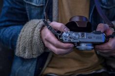 a person holding a camera in their hands