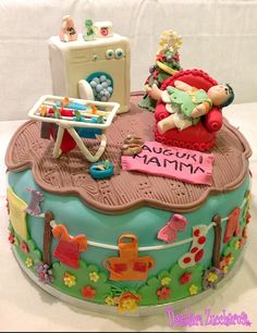 a birthday cake decorated with an image of a baby in a crib and toys