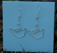 the earrings are made out of metal wire