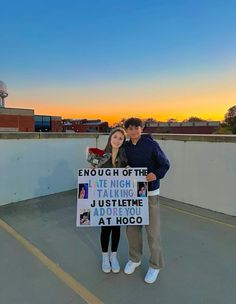 a man and woman standing next to each other holding up signs that read enough of the late night talking just listening at hoco