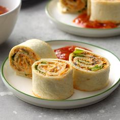 some food is sitting on a plate and ready to be eaten with sauces in the background