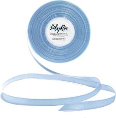 a light blue ribbon with white trim