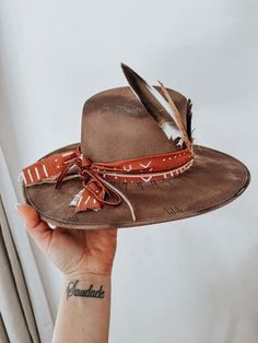 Introducing The Carmela Western Fedora Hat Crafted From 100% Natural Usa Products And Decorated With Wild Bird And Pheasant Feathers, Custom-made Belts, And Burned Queens Playing Cards - An Eye-catching Design Fit For Any Occasion! Feeling Fancy? Mix And Match Bands, Ribbons, Feathers, And Cards To Get That One Of a Kind Look. Every Hat Is Perfectly Distressed For An Unforgettable Flair. Grab Your Daniels Western Fedora Hat Today!
** Hat Maybe Slightly Darker/lighter In Person Due To Flash In Pictures.**Western Hats For Women Custom Cowboy Hat Wide Brim Fedora Fedoras For Women Custom Cowgirl Hat Bride Cowgirl Hat Boho Hat Luxury Handmade Western Felt Hat, Luxury Brown Hat Bands For Country Events, Bride Cowgirl Hat, Western Hats For Women, Custom Fedora, Womens Western Hats, Cowboy Hat Styles, Custom Cowboy Hats, Cowboy Hat Bands