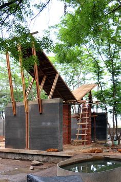 a building under construction next to a tree