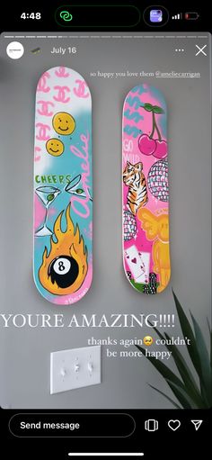 two colorful skateboards sitting next to each other