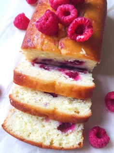 raspberry pound cake with fresh raspberries on top and slices cut off