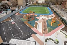 an aerial view of a basketball court and playground in the city with children's play equipment