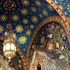 an ornately decorated ceiling with chandeliers and paintings