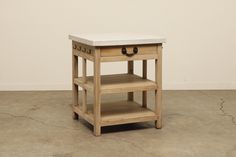 a small wooden table with two drawers on one side and an open drawer on the other