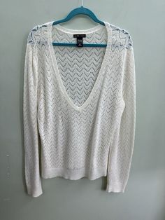 Elevate your wardrobe with this stunning white long sleeve deep V-neck woven acrylic sweater from NY&C. The classic cardigan style and solid pattern make it a versatile piece for any occasion. The lightweight and all-season features make it a must-have addition to your closet. Crafted with high-quality knit fabric, this sweater boasts a V-neckline that adds a touch of elegance to your outfit. The long sleeves provide warmth and comfort, making it perfect for chilly days. With its size L and regular size type, it's an ideal fit for any woman looking for a stylish and comfortable sweater. *disclaimer: all items come from a smoke-free, dog-friendly home. Acrylic Sweater, Classic Cardigan, Comfortable Sweater, Cardigan Fashion, White Long Sleeve, Sweater Sizes, Pullover Sweaters, Sweater Outfits, V Neck