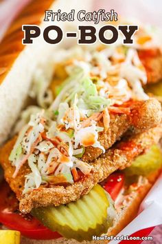 fried fish po - boy sandwich with pickles and coleslaw on it in a basket