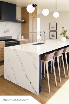 a kitchen with marble counter tops and bar stools